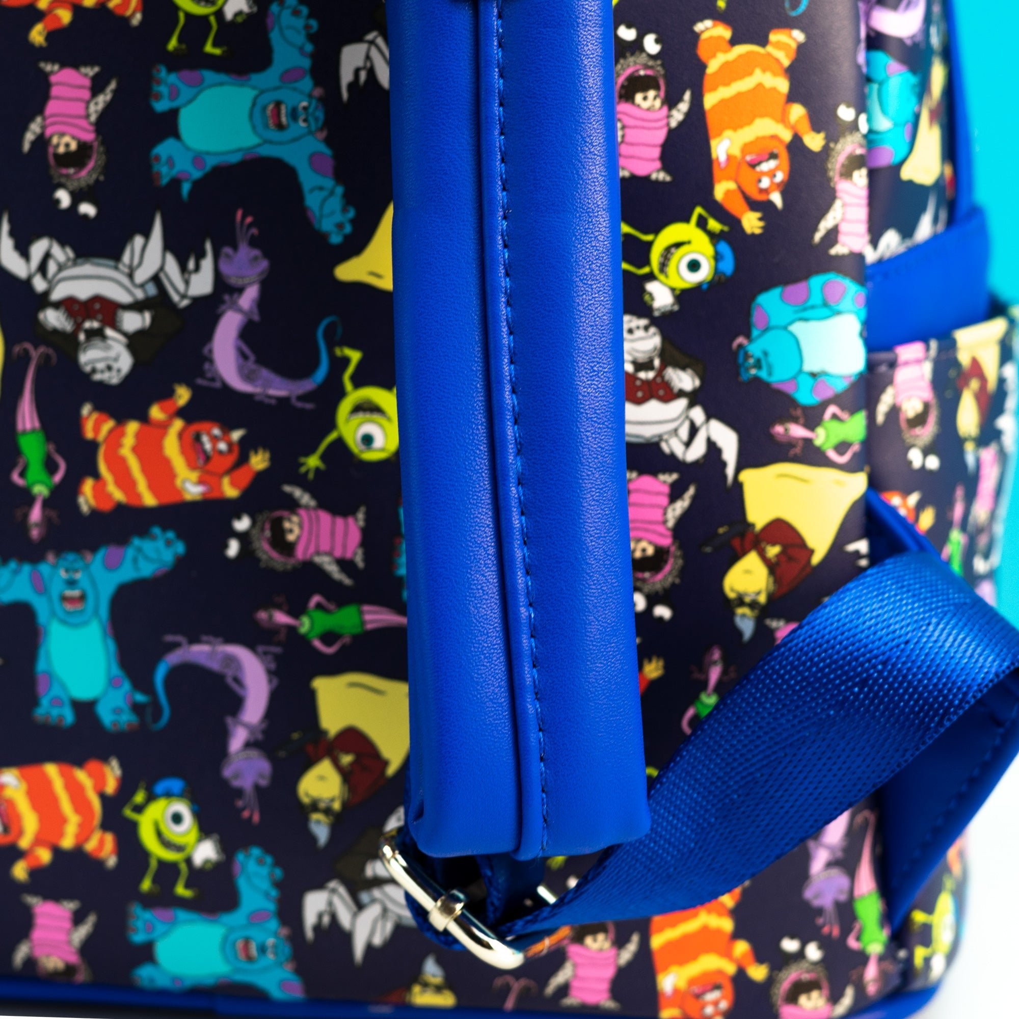 Loungefly x Disney Pixar Monsters Inc AOP Mini Backpack - GeekCore