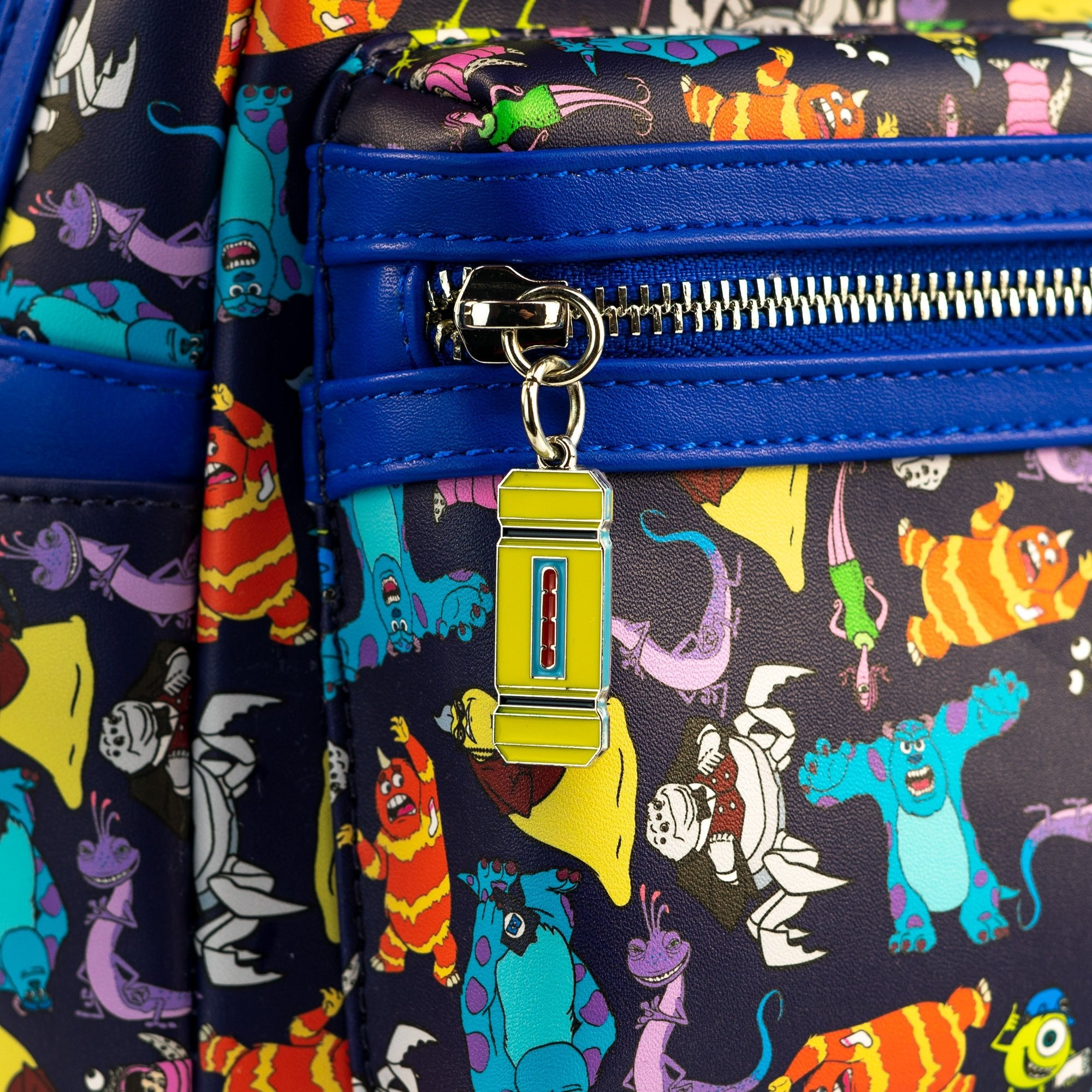 Loungefly x Disney Pixar Monsters Inc AOP Mini Backpack - GeekCore